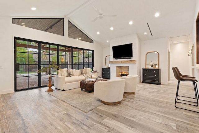 7202 Hartland Ave, Houston, TX 77055 - living room with light wood-type flooring, attic access, ceiling fan, recessed lighting, and high vaulted ceiling