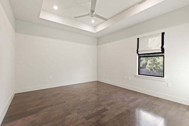 7202 Hartland Ave, Houston, TX 77055 - spare room featuring a tray ceiling, dark wood finished floors, a ceiling fan, and recessed lighting