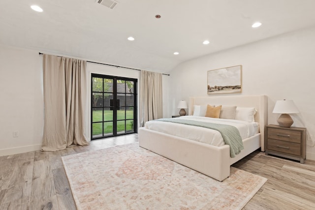 7202 Hartland Ave, Houston, TX 77055 - bedroom with access to outside, recessed lighting, light wood-style floors, and vaulted ceiling
