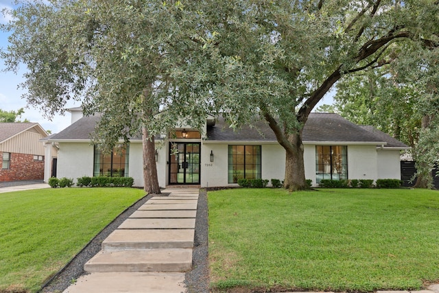 7202 Hartland Ave, Houston, TX 77055 - view of front of property with a front yard, an attached garage, and roof with shingles