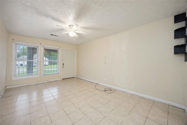 4526 Kingsbury St, Houston, TX 77021 - unfurnished room with ceiling fan, a textured ceiling, and light tile patterned floors