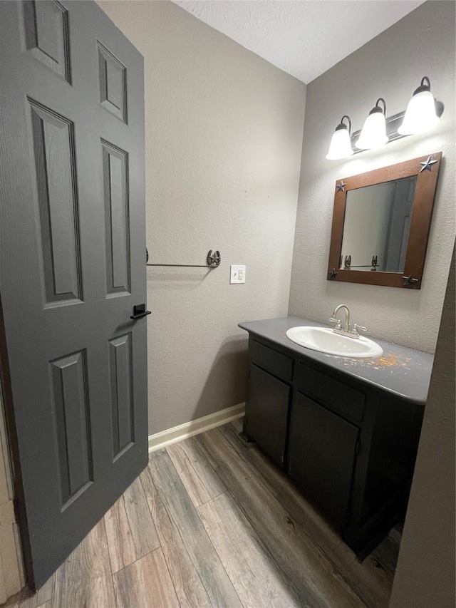 126 2nd Ave, Onalaska, TX 77360 - bathroom with vanity and wood finished floors