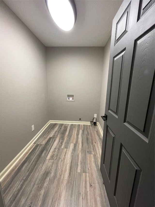 126 2nd Ave, Onalaska, TX 77360 - washroom with hookup for a washing machine and wood finished floors
