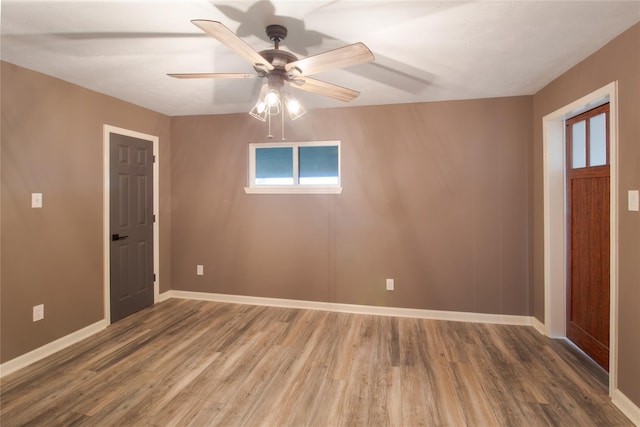 126 2nd Ave, Onalaska, TX 77360 - spare room featuring wood finished floors and ceiling fan