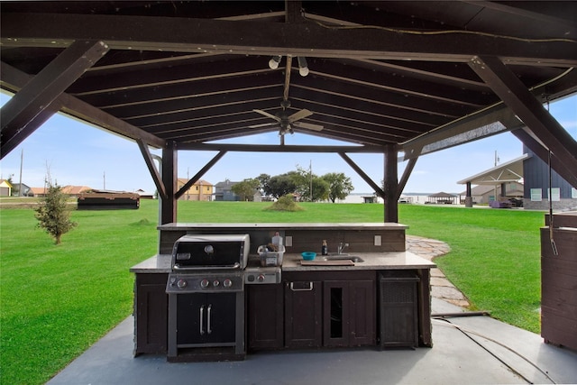 126 2nd Ave, Onalaska, TX 77360 - view of patio with an outdoor kitchen and a sink
