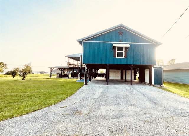 126 2nd Ave, Onalaska, TX 77360 - beach home with a carport, a front lawn, and asphalt driveway