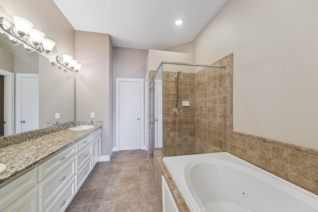 11315 S Main St Unit 1205, Houston, TX 77025 - bathroom with a tub with jets, a stall shower, and double vanity