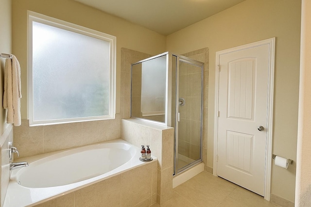 3543 Paganini Pl, Katy, TX 77493 - bathroom featuring a bath, a shower stall, and tile patterned flooring