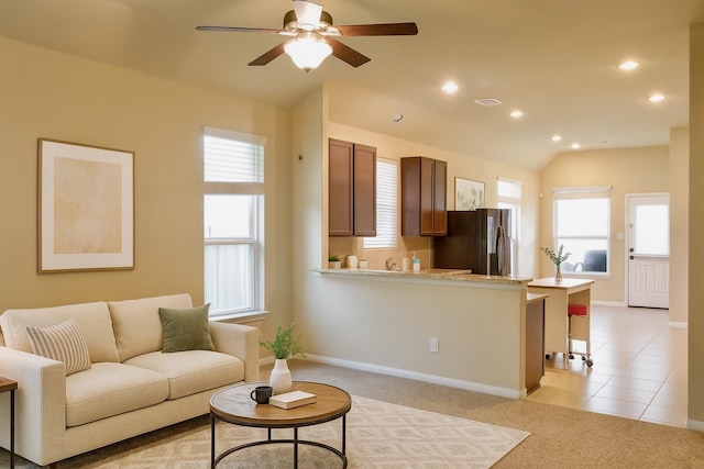 3543 Paganini Pl, Katy, TX 77493 - living area with vaulted ceiling, ceiling fan, plenty of natural light, recessed lighting, and light carpet