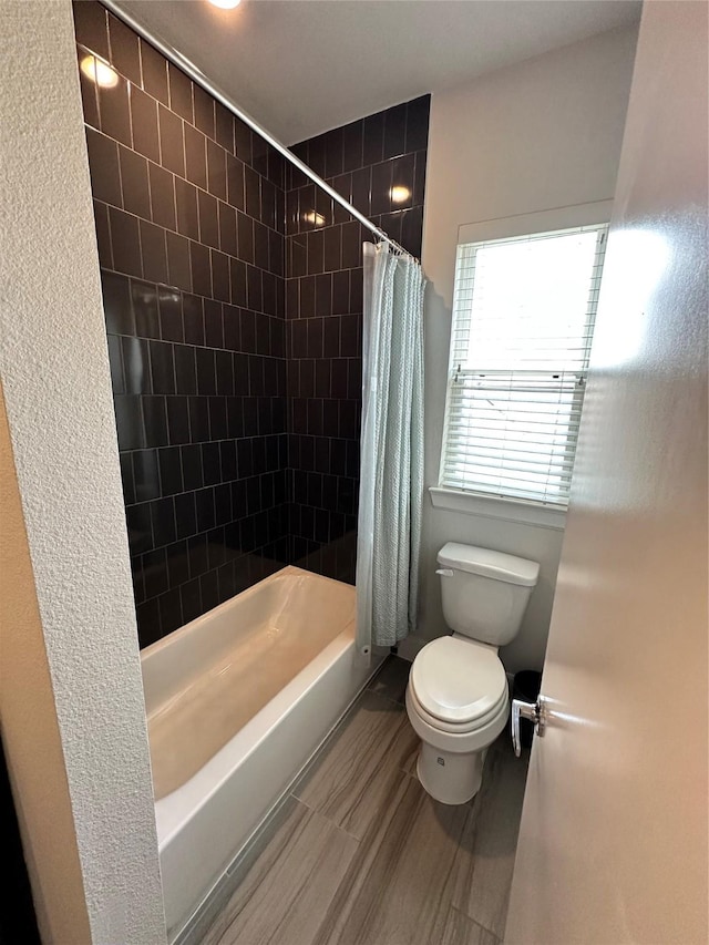 311 Eado Park Cir, Houston, TX 77020 - bathroom featuring toilet and shower / bathtub combination with curtain