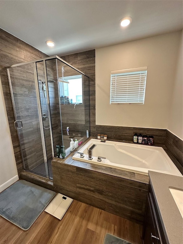 311 Eado Park Cir, Houston, TX 77020 - bathroom featuring a bath, a stall shower, vanity, wood finished floors, and recessed lighting