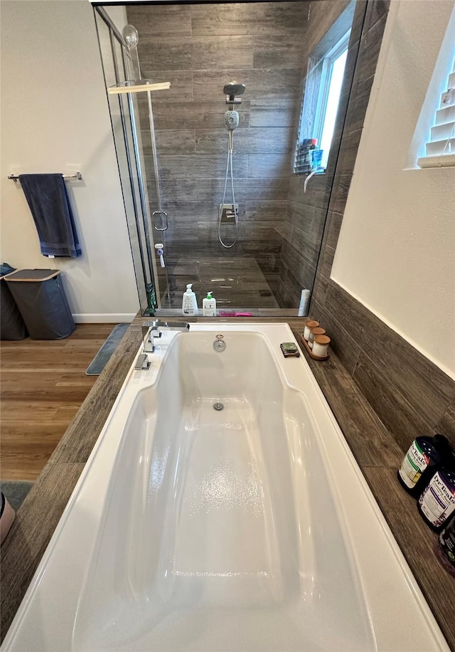 311 Eado Park Cir, Houston, TX 77020 - bathroom with a stall shower and wood finished floors