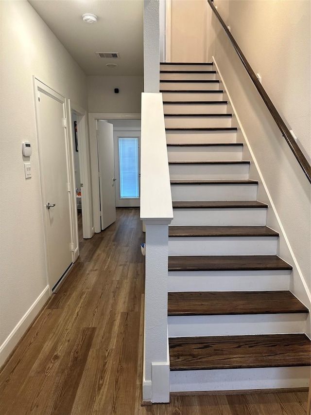 311 Eado Park Cir, Houston, TX 77020 - stairway featuring wood finished floors and baseboards