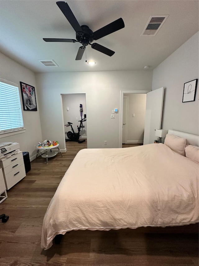 311 Eado Park Cir, Houston, TX 77020 - bedroom featuring dark wood finished floors and a ceiling fan