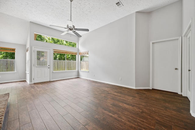 3518 Grove Oaks Dr, Houston, TX 77339 - unfurnished living room with a ceiling fan, a textured ceiling, wood finished floors, and high vaulted ceiling