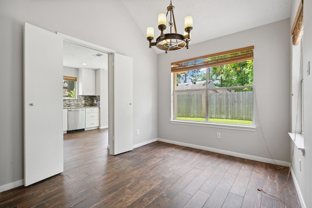 3518 Grove Oaks Dr, Houston, TX 77339 - unfurnished dining area featuring a chandelier, dark wood finished floors, and lofted ceiling