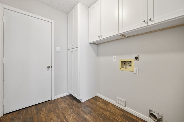 3518 Grove Oaks Dr, Houston, TX 77339 - washroom with hookup for an electric dryer, dark wood-style flooring, cabinet space, hookup for a washing machine, and a textured ceiling