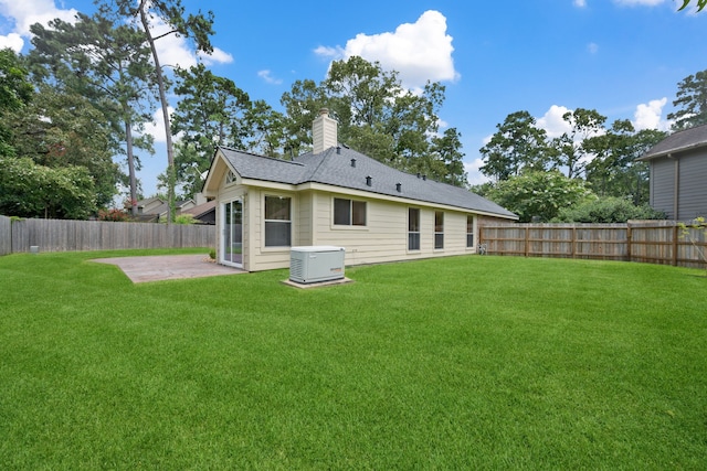 3518 Grove Oaks Dr, Houston, TX 77339 - back of house featuring a patio area, a fenced backyard, and a chimney