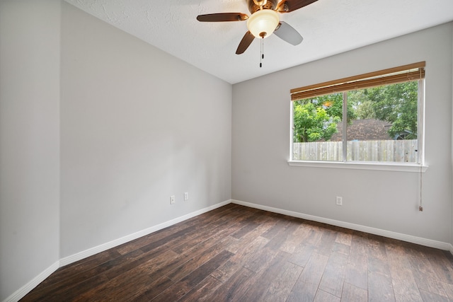 3518 Grove Oaks Dr, Houston, TX 77339 - empty room featuring dark wood-type flooring and a ceiling fan