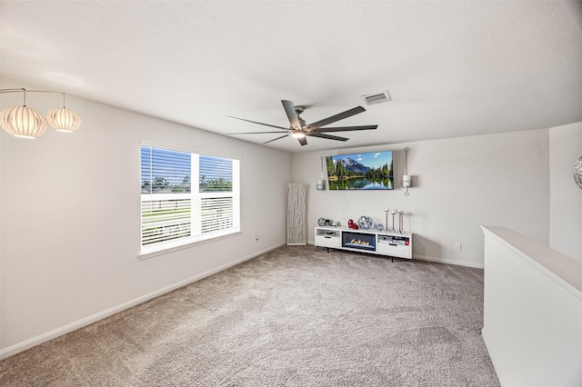 11034 Hillside Creek Dr, Humble, TX 77396 - unfurnished living room featuring a ceiling fan and carpet flooring