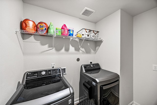 11034 Hillside Creek Dr, Humble, TX 77396 - laundry area featuring baseboards and washer and clothes dryer