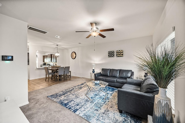 11034 Hillside Creek Dr, Humble, TX 77396 - living room featuring carpet flooring and ceiling fan