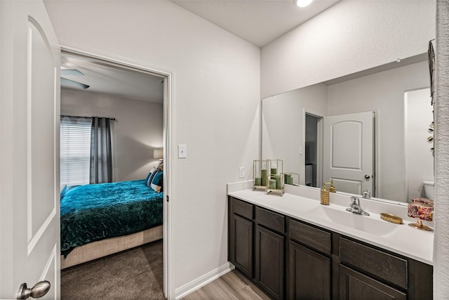 11034 Hillside Creek Dr, Humble, TX 77396 - full bath featuring double vanity, ensuite bathroom, and wood finished floors