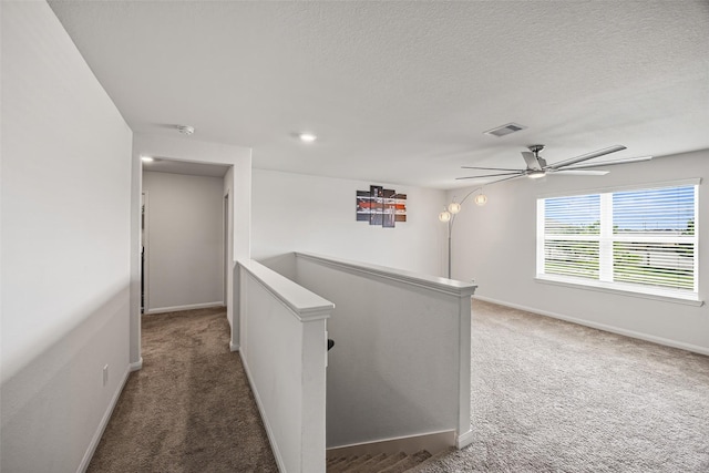 11034 Hillside Creek Dr, Humble, TX 77396 - hall featuring an upstairs landing, carpet floors, and a textured ceiling