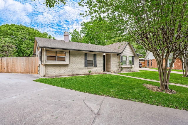 13506 Sherwood St, Sugar Land, TX 77498 - ranch-style house with brick siding, a chimney, driveway, and a shingled roof