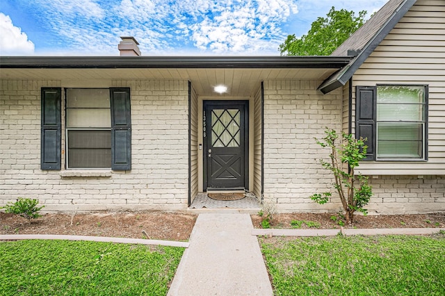 13506 Sherwood St, Sugar Land, TX 77498 - property entrance with brick siding and a chimney