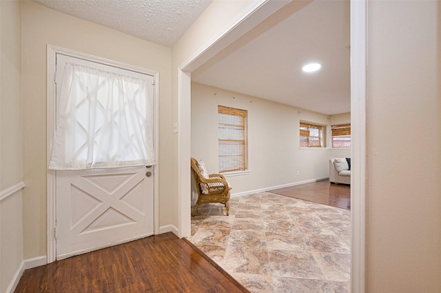 13506 Sherwood St, Sugar Land, TX 77498 - corridor with baseboards and stone finish floors