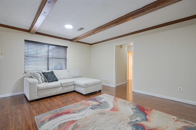 13506 Sherwood St, Sugar Land, TX 77498 - living area featuring beam ceiling, wood finished floors, a textured ceiling, and ornamental molding