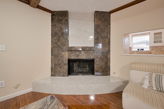 13506 Sherwood St, Sugar Land, TX 77498 - living room featuring wood finished floors and a tiled fireplace