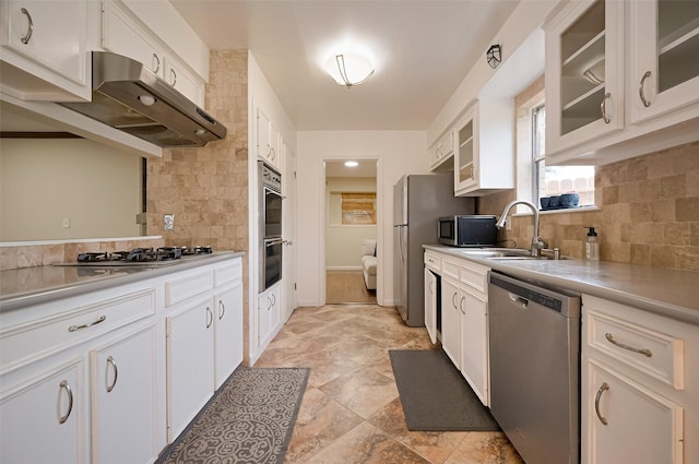13506 Sherwood St, Sugar Land, TX 77498 - kitchen featuring stainless steel appliances, tasteful backsplash, under cabinet range hood, and light countertops