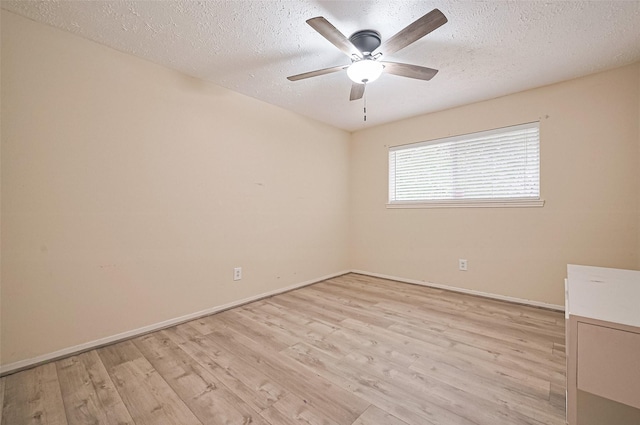 13506 Sherwood St, Sugar Land, TX 77498 - unfurnished room featuring light wood-style flooring, a textured ceiling, and a ceiling fan