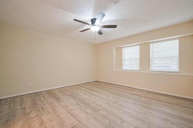 13506 Sherwood St, Sugar Land, TX 77498 - unfurnished room featuring a textured ceiling, wood finished floors, and a ceiling fan
