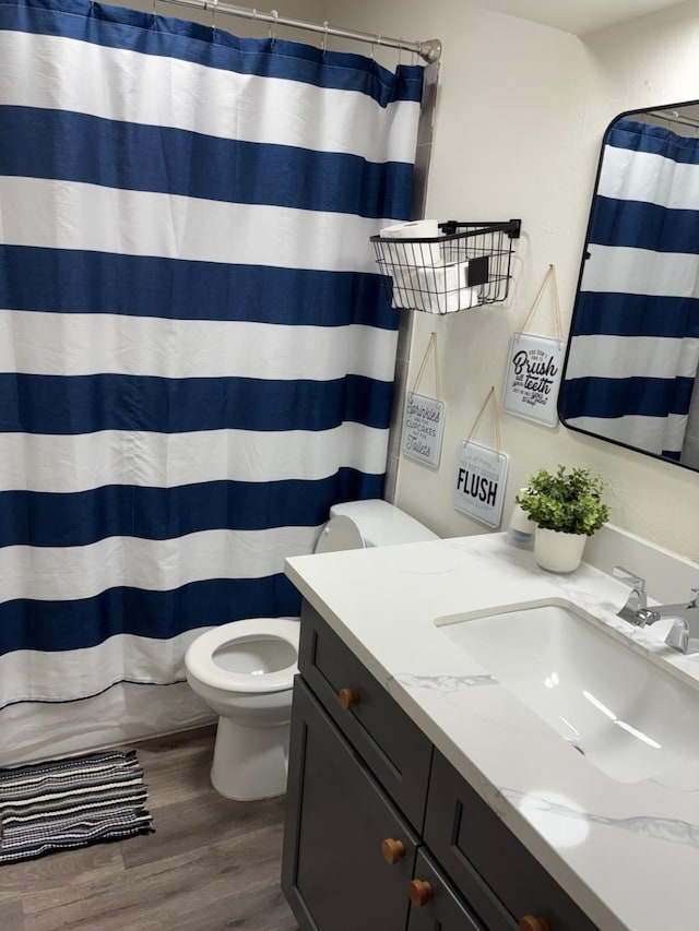 1529 Wirt Rd Unit 6, Houston, TX 77055 - bathroom featuring vanity, wood finished floors, and curtained shower