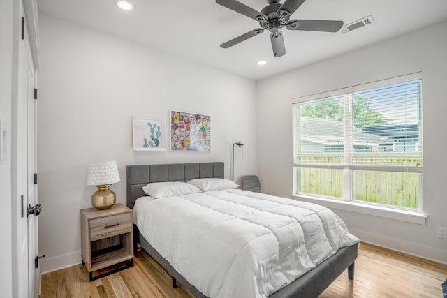 703 Dumble St, Houston, TX 77023 - bedroom with recessed lighting, light wood-style flooring, and ceiling fan