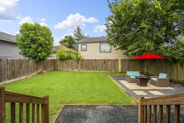 703 Dumble St, Houston, TX 77023 - fenced backyard with outdoor lounge area and a patio