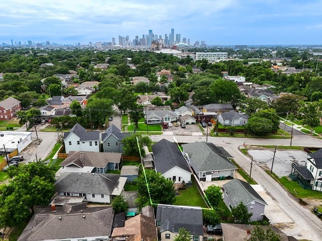 703 Dumble St, Houston, TX 77023 - aerial view of residential area featuring property parcel outlined and city skyline