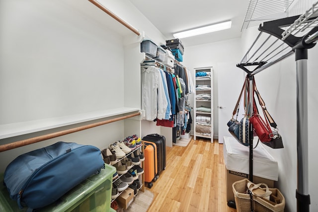 2010 Blodgett St Unit G, Houston, TX 77004 - walk in closet featuring light wood-style flooring