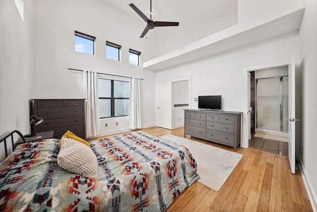 2010 Blodgett St Unit G, Houston, TX 77004 - bedroom with a towering ceiling, wood finished floors, a ceiling fan, and ensuite bathroom