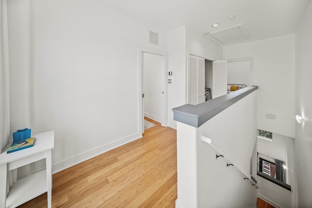 2010 Blodgett St Unit G, Houston, TX 77004 - hall with an upstairs landing, wood finished floors, attic access, and recessed lighting