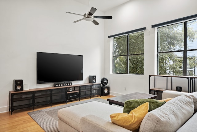 2010 Blodgett St Unit G, Houston, TX 77004 - living area with plenty of natural light, ceiling fan, wood finished floors, and a high ceiling