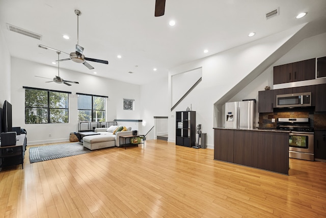 2010 Blodgett St Unit G, Houston, TX 77004 - living area with ceiling fan, recessed lighting, and light wood-type flooring