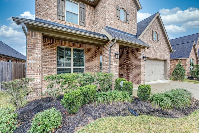 2131 Blossomcrown Dr, Katy, TX 77494 - traditional-style house with brick siding, driveway, and roof with shingles