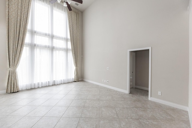 2131 Blossomcrown Dr, Katy, TX 77494 - spare room with a ceiling fan, high vaulted ceiling, and light tile patterned floors