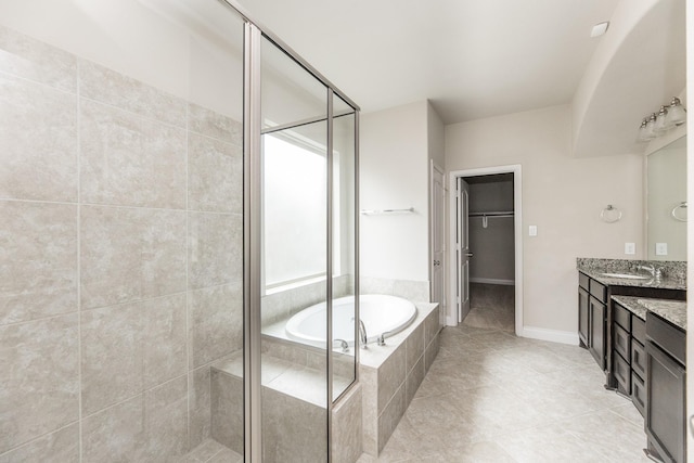2131 Blossomcrown Dr, Katy, TX 77494 - bathroom with a shower stall, vanity, a bath, a walk in closet, and tile patterned flooring