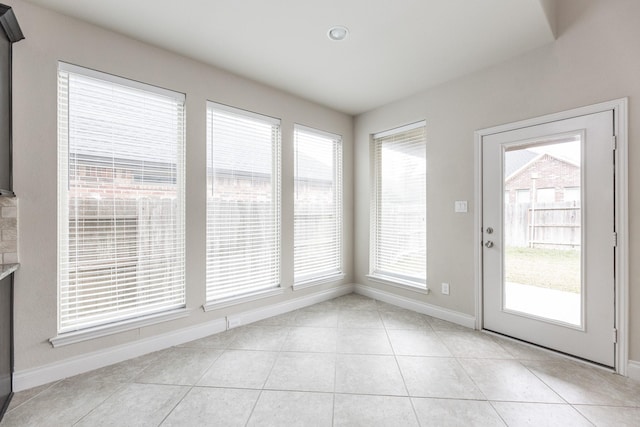 2131 Blossomcrown Dr, Katy, TX 77494 - unfurnished sunroom featuring baseboards and tile patterned flooring