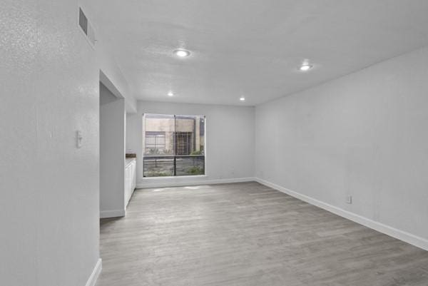 9005 Imogene St Unit C, Houston, TX 77036 - empty room featuring wood finished floors and recessed lighting